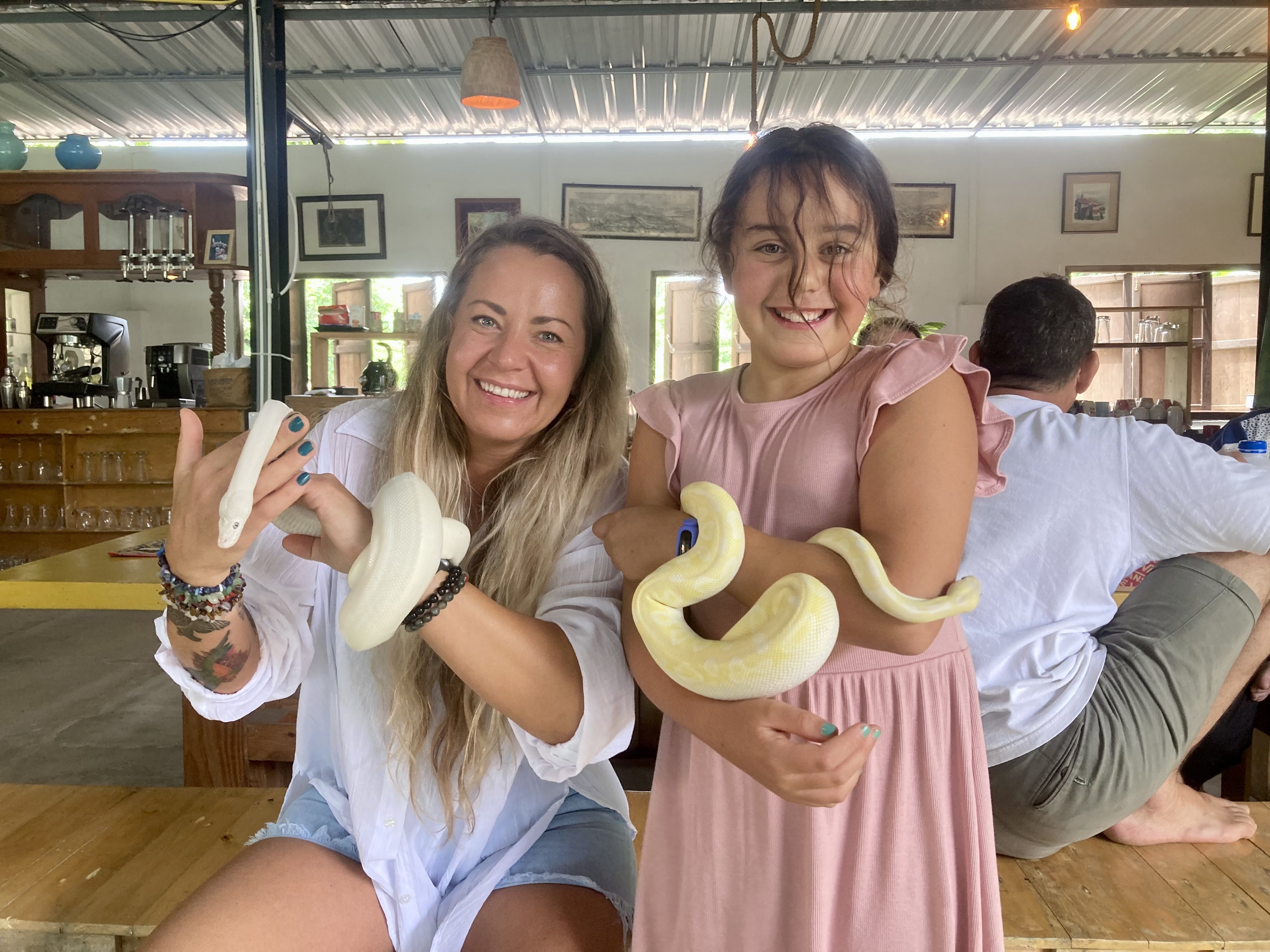 Guests meeting the snakes at Tree Roots Retreat, Rayong