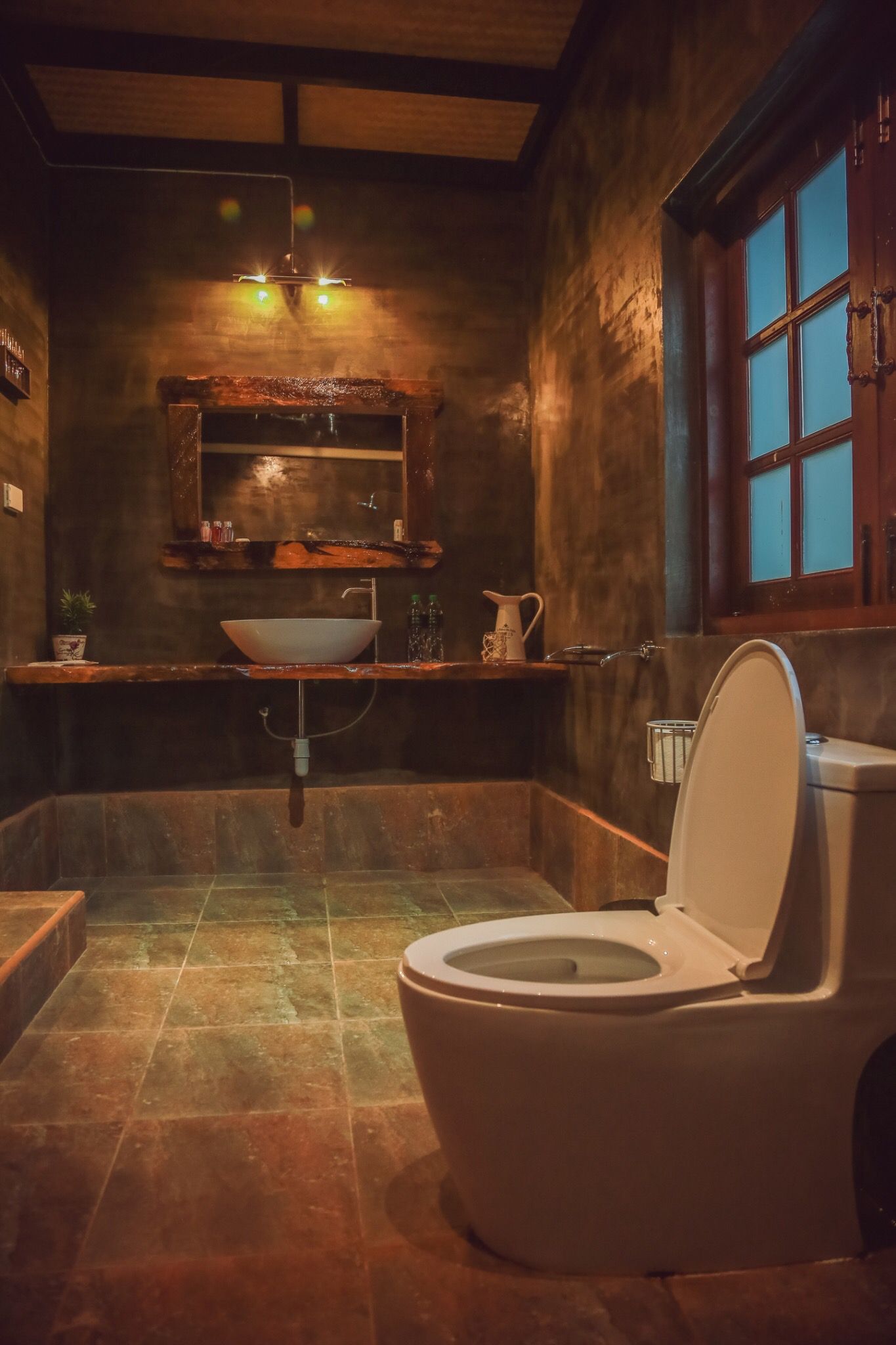 Garden-room bathroom with natural materials at Tree Roots Retreat, Rayong