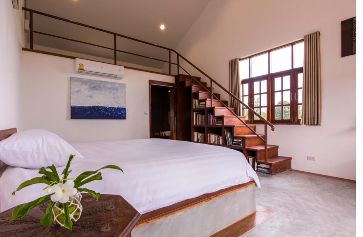 Garden room opening onto the pool at Tree Roots Retreat, Rayong