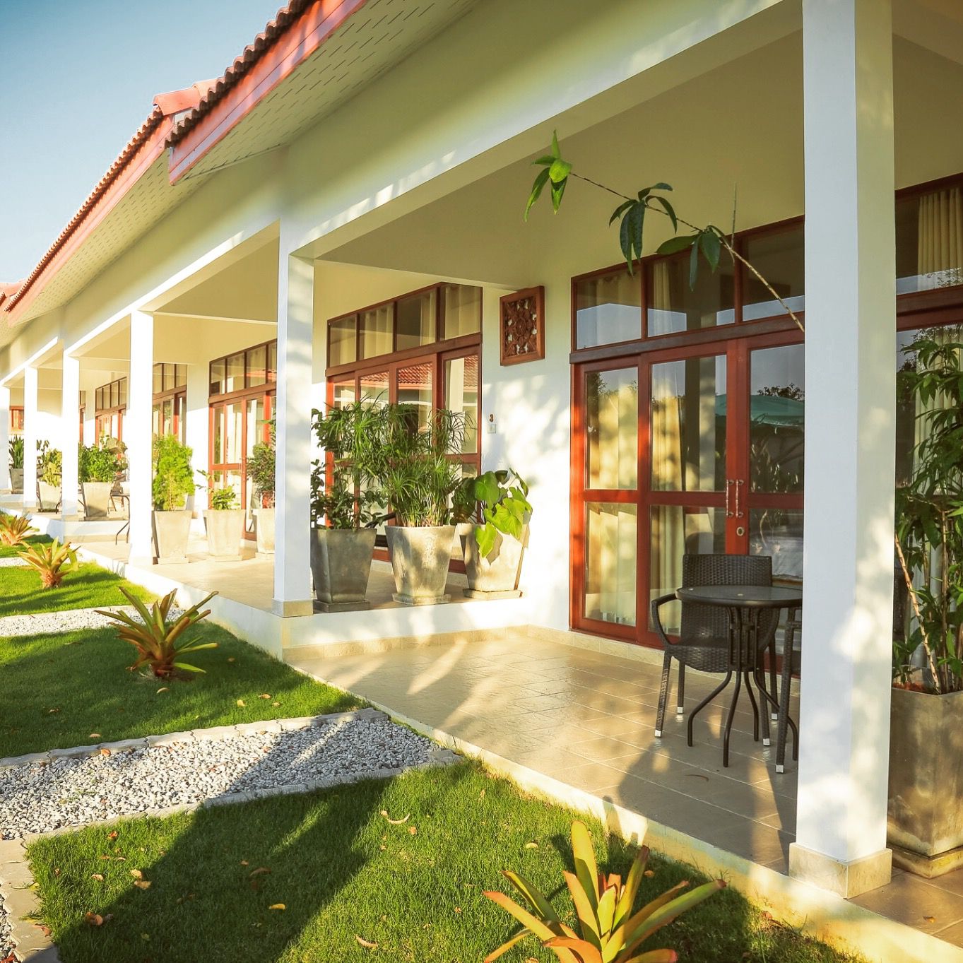 Private garden veranda outside a room at Tree Roots Retreat, Rayong