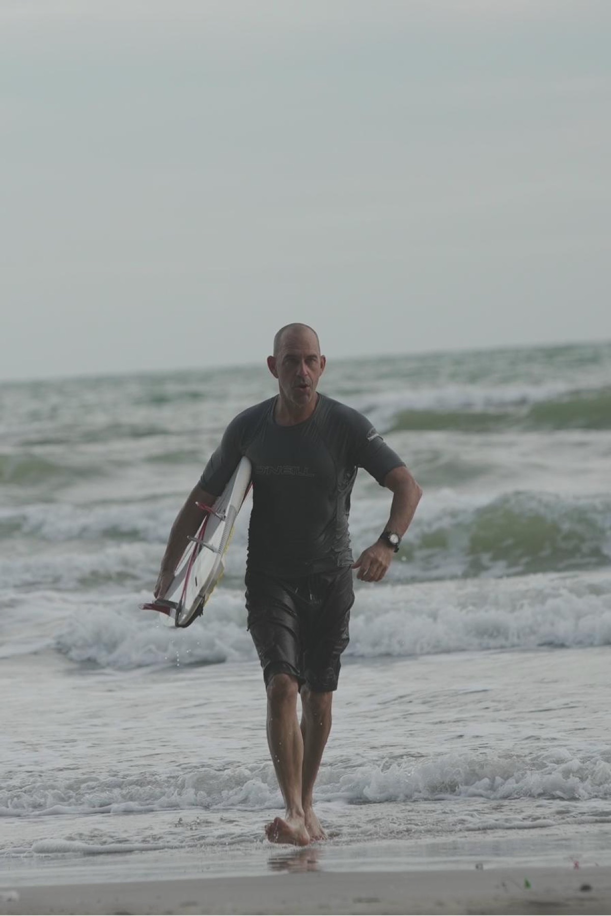 Surfing at Mae Ram Phueng Beach, Rayong, Gulf of Thailand