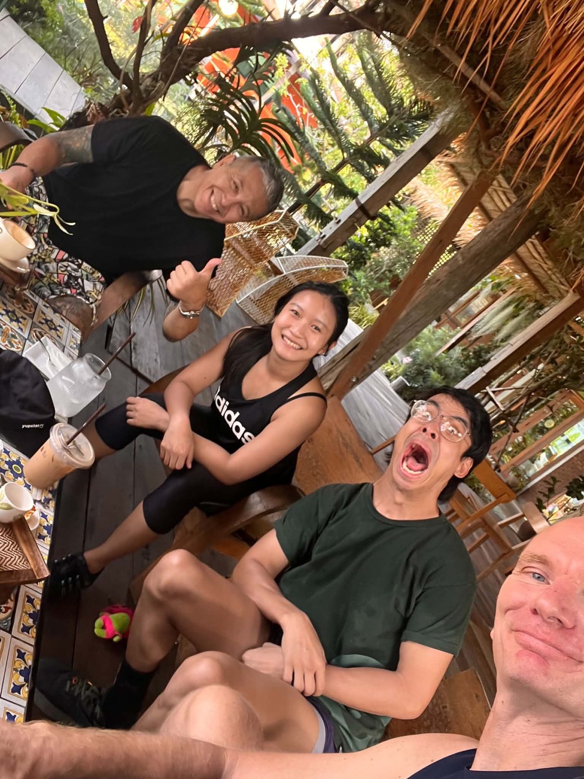 Michael and the Tree Roots Retreat team on the patio at the jiujitsu retreat in Mae Ram Phueng, Rayong, Thailand &mdash; a candid group shot between Brazilian Jiu-Jitsu sessions.